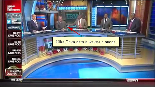 Photo shows Mike Ditka being nudged by Keyshawn Johnson after Ditka fell asleep on December 29th's ESPN's Sunday NFL Countdown.