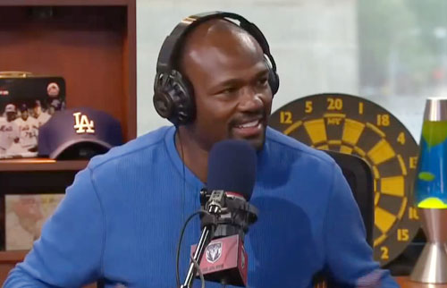 Photo shows Harold Reynolds speaking with Dan Patrick in September 2014.