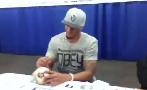 Photo shows Colin Kaepernick signing autographs at a Tristar event in 2012.