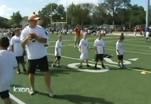 colt-mccoy-works-with-kids-procamp-austin-tx-jul-2012